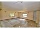 Bedroom with tile floor and two windows at 1294 1/2 38Th Nw St, Winter Haven, FL 33881