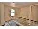 A bedroom with two windows and tile floor at 1294 1/2 38Th Nw St, Winter Haven, FL 33881