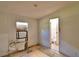 Bedroom with window view and doorway to bathroom at 1294 1/2 38Th Nw St, Winter Haven, FL 33881