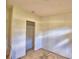 Bedroom with bare floors and doorway to closet at 1294 1/2 38Th Nw St, Winter Haven, FL 33881