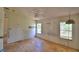 View of an empty bedroom with light walls and a ceiling fan hanging, along with windows providing natural light at 1294 1/2 38Th Nw St, Winter Haven, FL 33881
