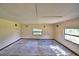 Bedroom with tile floor and two windows at 1294 1/2 38Th Nw St, Winter Haven, FL 33881
