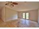 Bright bedroom featuring double doors leading to the backyard, offering a seamless indoor-outdoor flow at 1294 1/2 38Th Nw St, Winter Haven, FL 33881