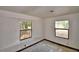 Bedroom featuring two windows providing natural light at 1294 1/2 38Th Nw St, Winter Haven, FL 33881