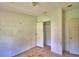 View of an empty bedroom with light walls and a ceiling fan hanging, along with windows providing natural light at 1294 1/2 38Th Nw St, Winter Haven, FL 33881