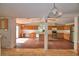 Well-lit kitchen featuring wooden cabinets and stainless steel appliances with an adjacent living space at 1294 1/2 38Th Nw St, Winter Haven, FL 33881