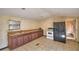 Kitchen area showcasing extensive countertops and an adjacent black refrigerator at 1294 1/2 38Th Nw St, Winter Haven, FL 33881