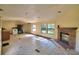 Spacious living room with fireplace and large windows that offer great natural light at 1294 1/2 38Th Nw St, Winter Haven, FL 33881