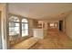 Spacious living room with large windows providing ample natural light and a breakfast bar separating the kitchen area at 1294 1/2 38Th Nw St, Winter Haven, FL 33881