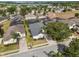 Aerial view of a single-story home in a residential community, showcasing landscaping and neighborhood streets at 135 Minniehaha Cir, Haines City, FL 33844