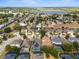 Aerial view of a residential community near a lake, showcasing the property's location and neighborhood at 135 Minniehaha Cir, Haines City, FL 33844