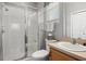 Modern bathroom featuring white tile, a glass shower and a vanity with sink at 135 Minniehaha Cir, Haines City, FL 33844
