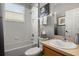 Cozy bathroom features a tub and shower combo, as well as a vanity at 135 Minniehaha Cir, Haines City, FL 33844