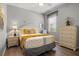 Inviting bedroom featuring a neutral palette, natural light, and ample storage at 135 Minniehaha Cir, Haines City, FL 33844