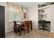 Bright dining room with a stylish light fixture and built-in desk area at 135 Minniehaha Cir, Haines City, FL 33844