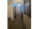 Foyer featuring neutral walls, wood flooring, and arched window for a bright entry at 135 Minniehaha Cir, Haines City, FL 33844