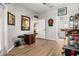 Spacious game room features wood floors, fun lighting and multiple games at 135 Minniehaha Cir, Haines City, FL 33844