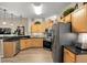 Kitchen featuring stainless steel appliances, dark countertops, and modern cabinetry at 135 Minniehaha Cir, Haines City, FL 33844