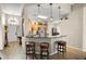 Eat-in kitchen with bar seating, modern pendant lighting and stainless appliances at 135 Minniehaha Cir, Haines City, FL 33844