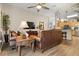Comfortable living room with wood floors, leather sofas, and an open floor plan to the kitchen at 135 Minniehaha Cir, Haines City, FL 33844