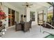 Covered patio features a dining table set and overlooks the beautiful pool at 135 Minniehaha Cir, Haines City, FL 33844