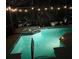 Enjoy this private, screened-in pool at night with landscape lighting at 135 Minniehaha Cir, Haines City, FL 33844