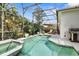 Enjoy the outdoors in the refreshing pool and spa, complete with lush tropical landscaping at 135 Minniehaha Cir, Haines City, FL 33844