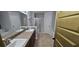 Bathroom featuring double vanity, walk in shower, separate tub, and tile flooring at 1400 Eagle Crest Blvd, Winter Haven, FL 33881