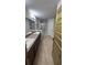 Bathroom featuring a double sink vanity, a glass shower, tile floors and a private toilet room at 1400 Eagle Crest Blvd, Winter Haven, FL 33881