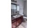 Bathroom featuring a vanity with granite countertops and a shower-tub combination with curtain at 1400 Eagle Crest Blvd, Winter Haven, FL 33881