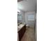Bathroom featuring tile floor, a single vanity, and a walk in shower with a glass door at 1400 Eagle Crest Blvd, Winter Haven, FL 33881