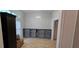 Bright room with a built-in shelving unit, tile flooring, and natural light at 1400 Eagle Crest Blvd, Winter Haven, FL 33881