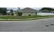 Street view of a well-manicured lawn surrounding a single-story home at 1400 Eagle Crest Blvd, Winter Haven, FL 33881