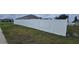 View of a pristine white fence providing privacy to the backyard at 1400 Eagle Crest Blvd, Winter Haven, FL 33881