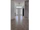 Inviting foyer with tile flooring, transom window, and sidelights at 1400 Eagle Crest Blvd, Winter Haven, FL 33881