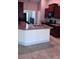 Spacious kitchen with breakfast bar, stone countertops and stainless steel appliances at 1400 Eagle Crest Blvd, Winter Haven, FL 33881