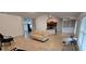 Spacious living room showing the open concept kitchen, tile floors, and natural light at 1400 Eagle Crest Blvd, Winter Haven, FL 33881
