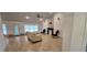 Spacious living room with tile flooring, a fireplace, and lots of natural light at 1400 Eagle Crest Blvd, Winter Haven, FL 33881