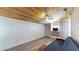 Bright living room with wood ceiling, white walls, vinyl floors, and a comfortable blue futon at 1515 W Lake Cannon Nw Dr, Winter Haven, FL 33881