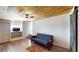 Comfortable living area featuring a wooden ceiling, modern flooring, and a cozy futon at 1515 W Lake Cannon Nw Dr, Winter Haven, FL 33881