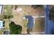 Aerial shot displays the home, yard, and neighborhood features at 1515 W Lake Cannon Nw Dr, Winter Haven, FL 33881