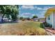Expansive backyard features a fenced area and additional storage shed at 1515 W Lake Cannon Nw Dr, Winter Haven, FL 33881