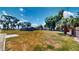 Expansive backyard featuring mature trees and ample space for outdoor activities and potential landscaping projects at 1515 W Lake Cannon Nw Dr, Winter Haven, FL 33881