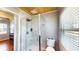 Well-lit bathroom features a tile and glass enclosed shower, and a water closet in a compact space at 1515 W Lake Cannon Nw Dr, Winter Haven, FL 33881