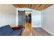 Bedroom area includes a wood ceiling, barn door and view into another room at 1515 W Lake Cannon Nw Dr, Winter Haven, FL 33881