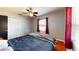 Bedroom with double door closet, ceiling fan and natural light at 1515 W Lake Cannon Nw Dr, Winter Haven, FL 33881
