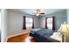 Bedroom with hardwood floors, ceiling fan, and natural light at 1515 W Lake Cannon Nw Dr, Winter Haven, FL 33881