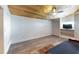 Comfortable bedroom features a wood ceiling, built in shelving, and access to another room at 1515 W Lake Cannon Nw Dr, Winter Haven, FL 33881