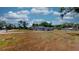 A lush, wide front yard adds curb appeal to this home and provides outdoor space at 1515 W Lake Cannon Nw Dr, Winter Haven, FL 33881
