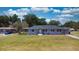 Attractive one-story home with tidy landscaping and a spacious front lawn at 1515 W Lake Cannon Nw Dr, Winter Haven, FL 33881